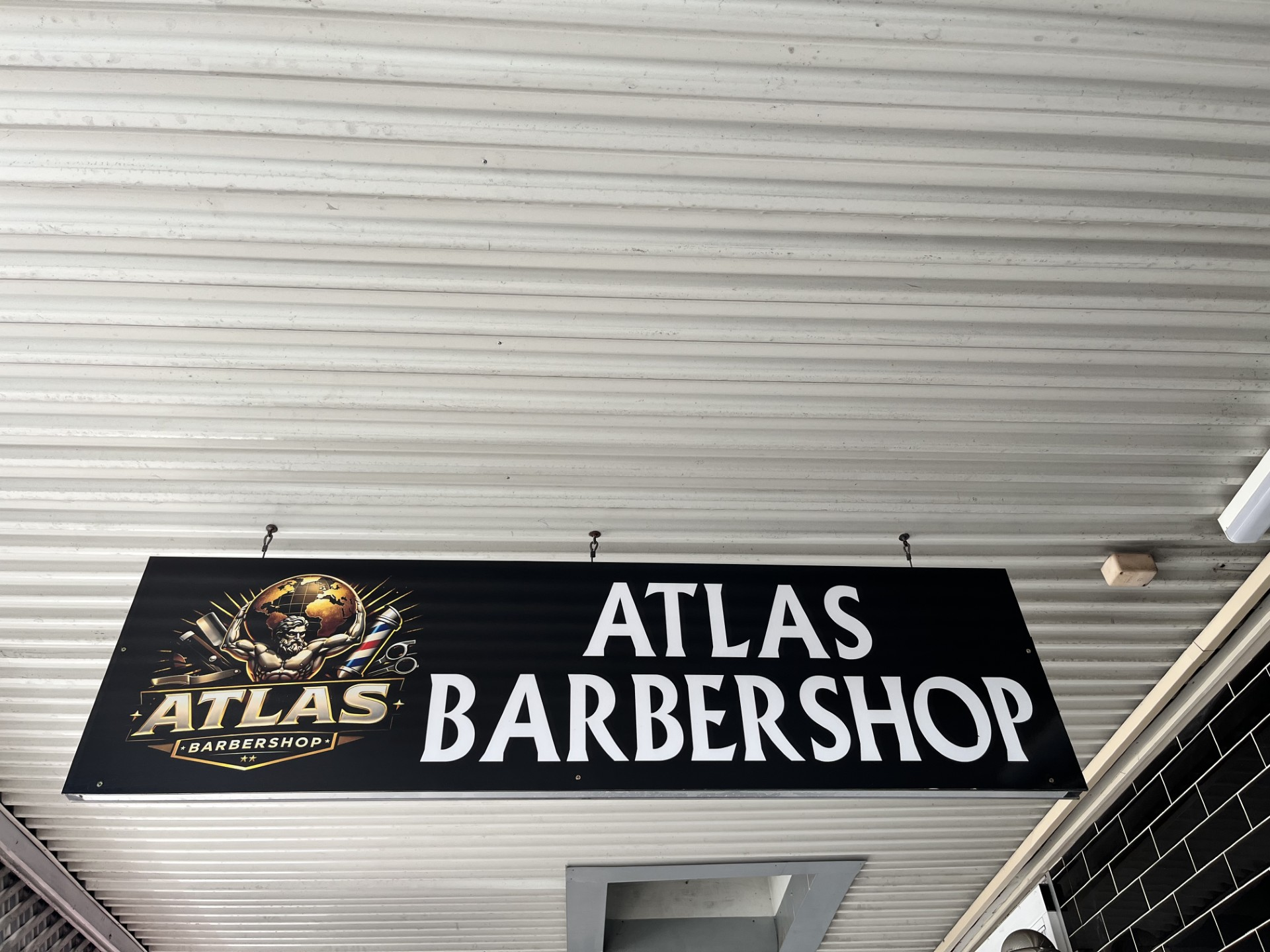Atlas Barbershop signage