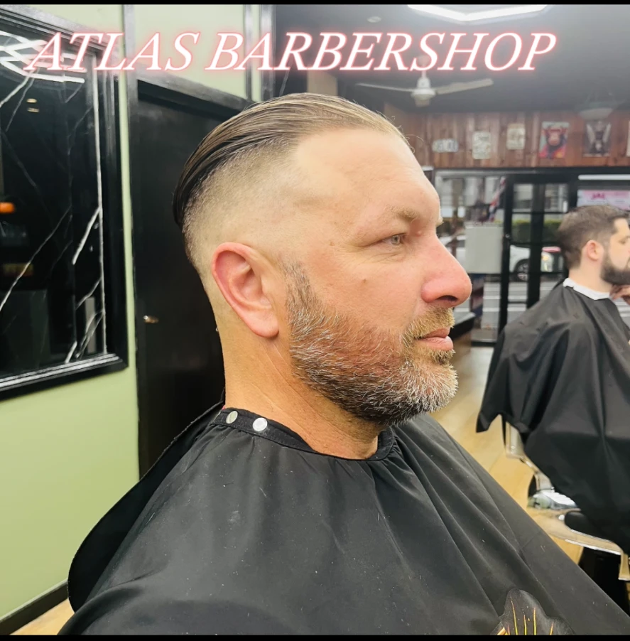 Slick-back with a high fade and tidy beard trim